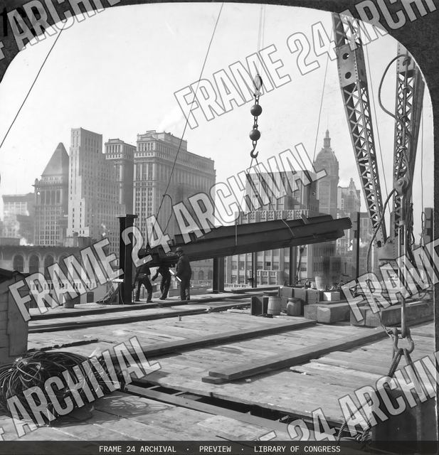 Building the steel frame for a skyscraper, vintage black and white photograph