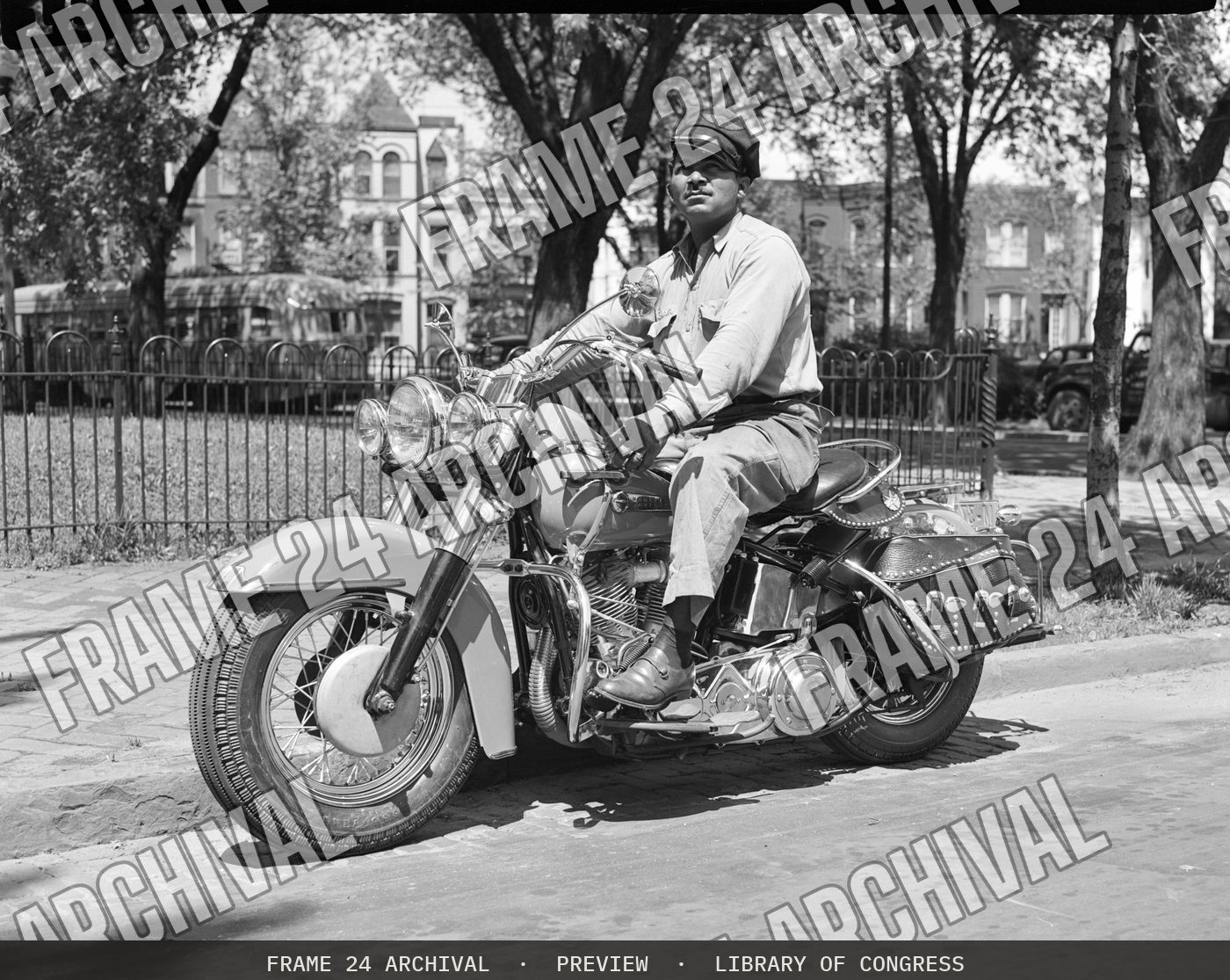 Charles Farrar on motorcycle, May (1949), restored vintage black and white photograph