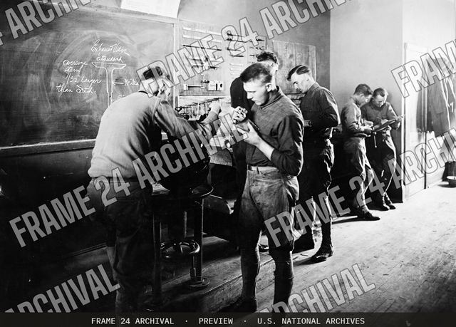 Colleges and Universities - Harley Davidson School for Motorcycle Mechanics - Studying the different parts of the motor at School for Motorcycle mechanics, vintage black and white photograph