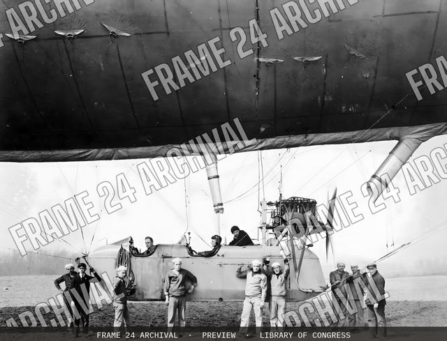 Group of men boarding an airship, vintage black and white photograph