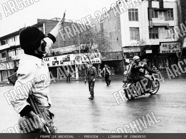 Haj Seyed Javdi, on back of motorcycle, Vice Minister of Islamic Guidance & Information, vintage black and white photograph