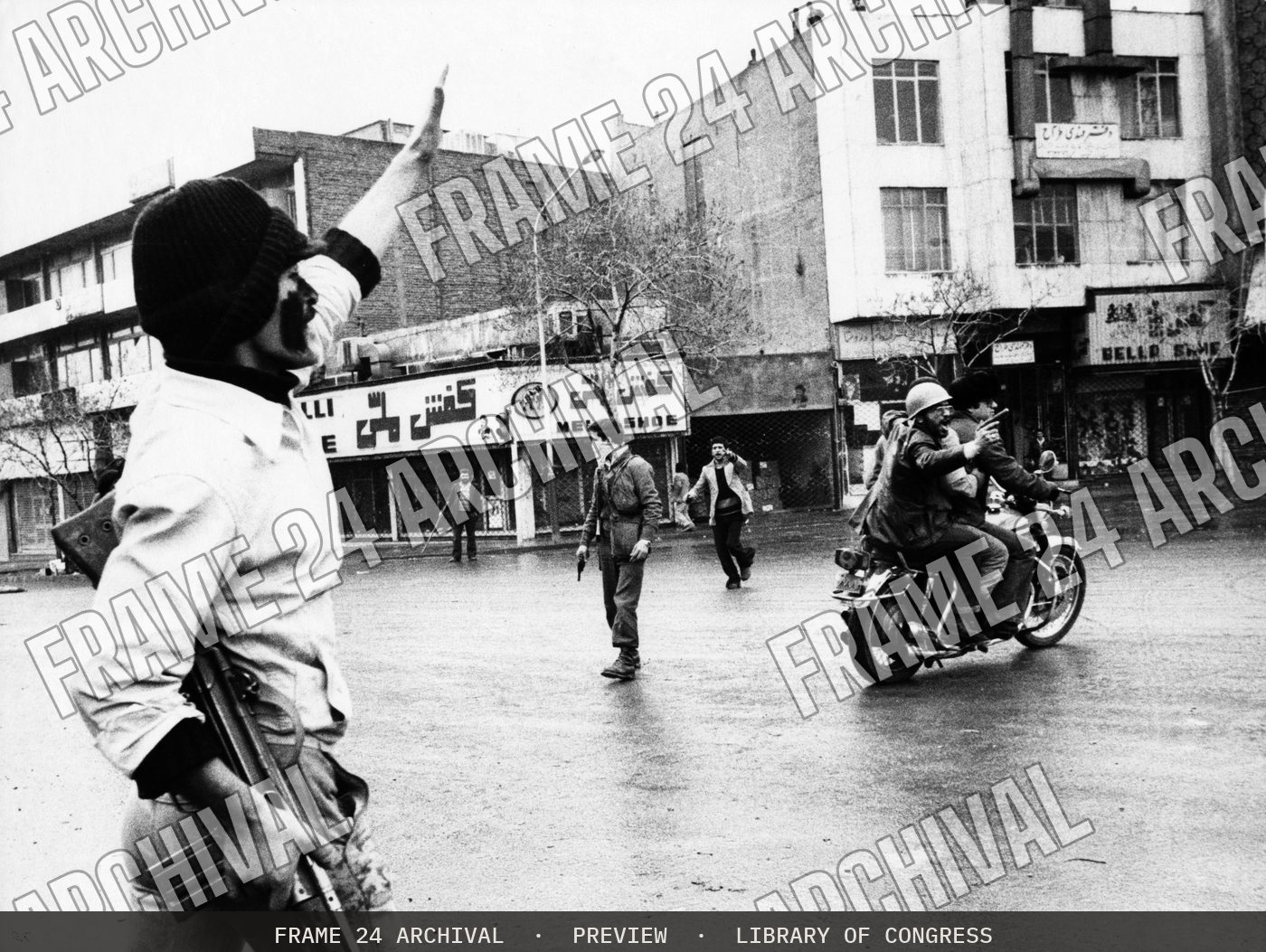 Haj Seyed Javdi, on back of motorcycle, Vice Minister of Islamic Guidance & Information (1979), restored vintage black and white photograph