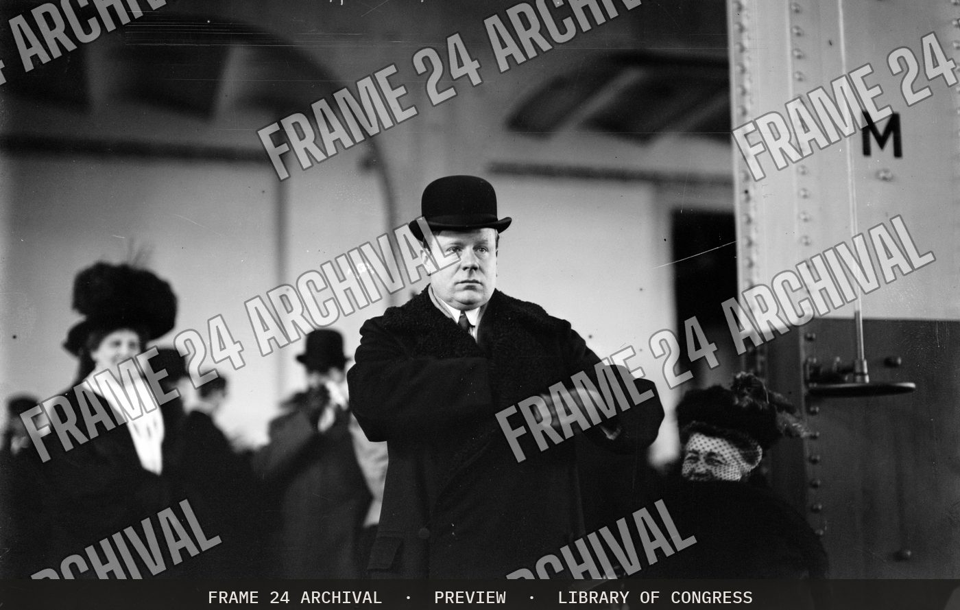Harry Lehr, at train station (1908), restored vintage black and white photograph