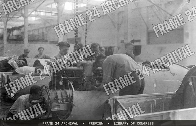 Installing aeroplane airplane engine, vintage black and white photograph