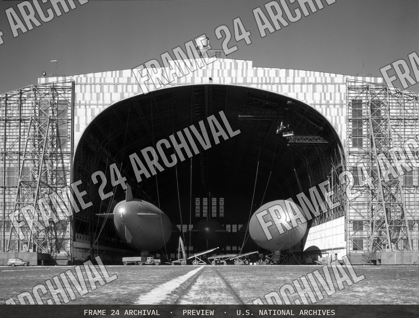 "K" Type Blimps in Airship Hangar at Naval Air Station, Lakehurst, New Jersey (1943), restored vintage black and white photograph