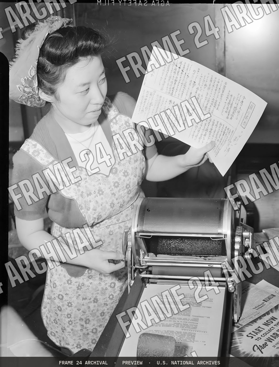 Los Angeles, California. Sadae Nomura, Associate Editor of the Los Angeles Daily News, is seen runn (1942), restored vintage black and white photograph