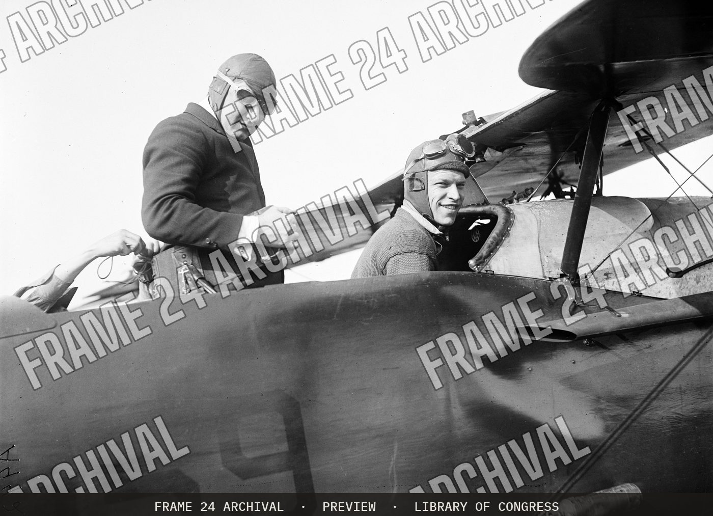 Men in airplane (1922), restored vintage black and white photograph