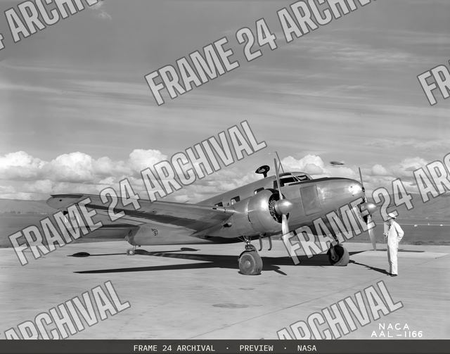 NACA photographer Lockheed 12A icing research airplane, vintage black and white photograph