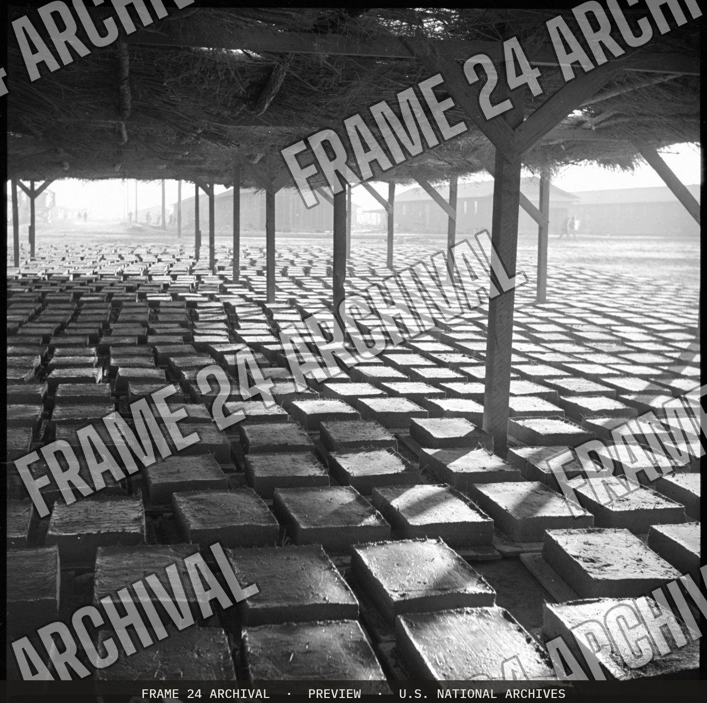Poston, Arizona. Adobe factory drying racks (1943), restored vintage black and white photograph