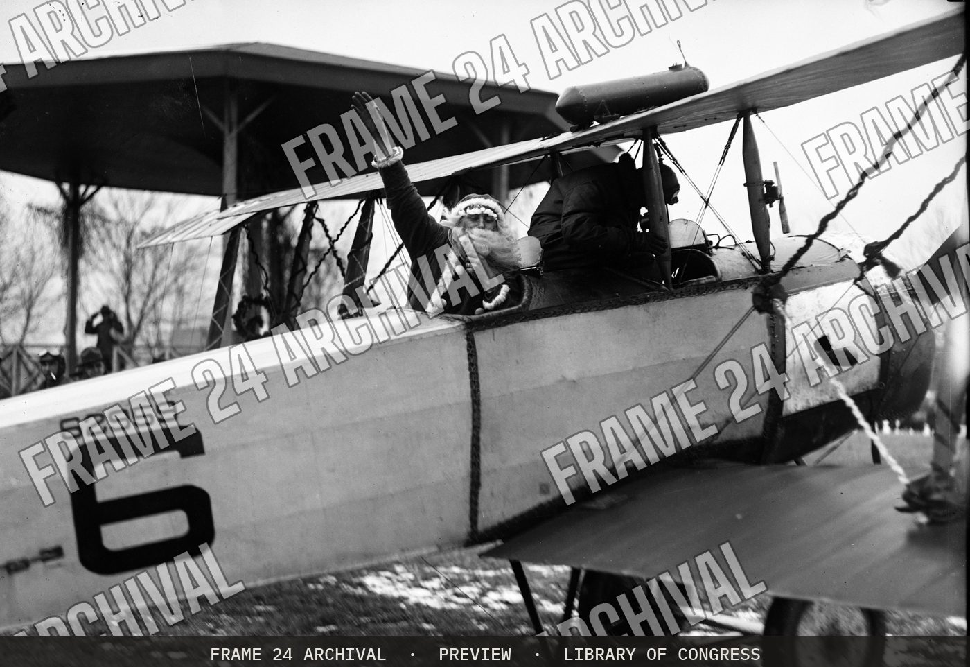 Santa in airplane (1915), restored vintage black and white photograph