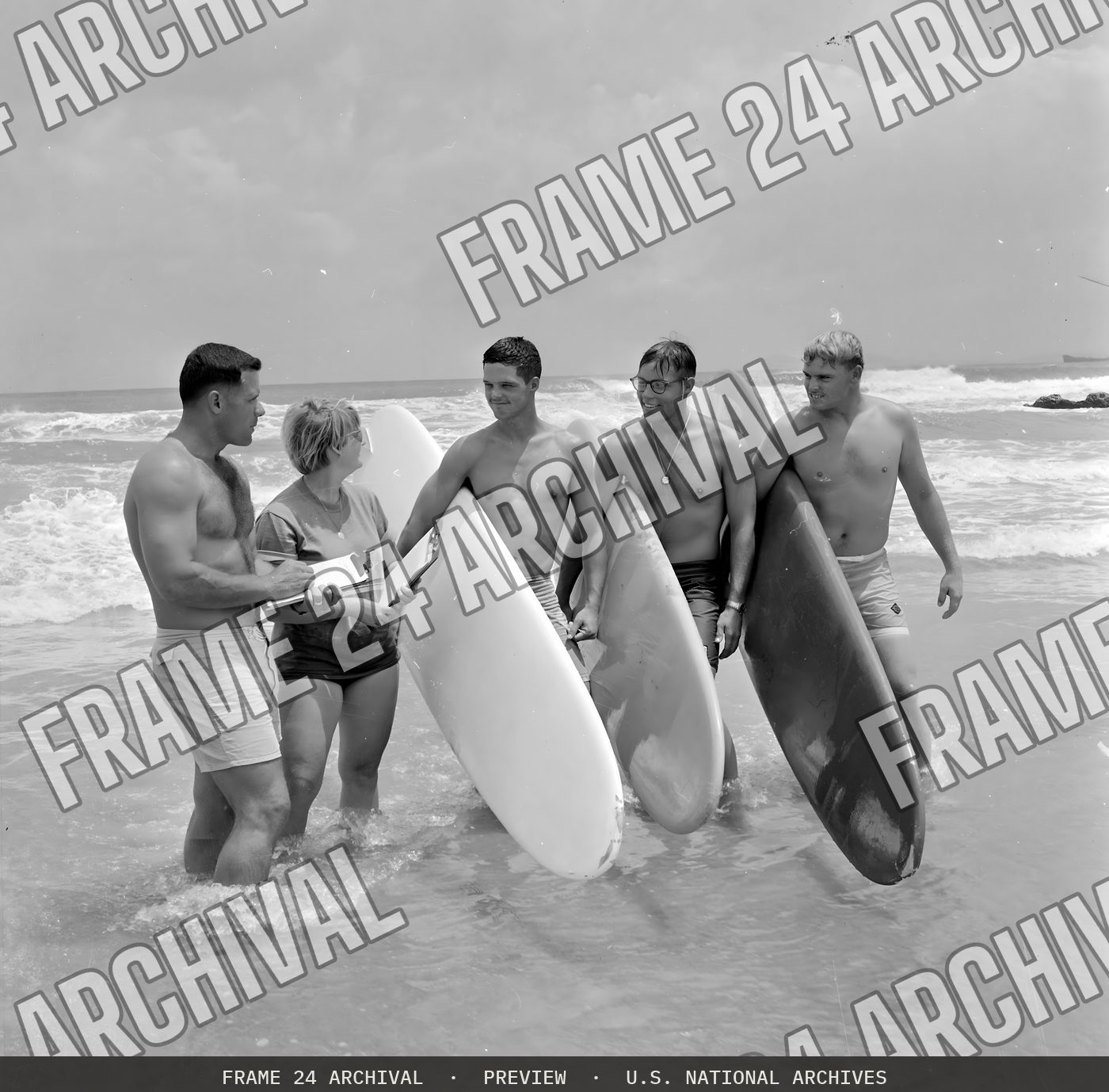 Surfing--Captain Rodney Bothelo, 1st Shore Party Battalion, and Miss Elli Vade Bon Cowur, Associate Director USO, judges for the OSO sponsored surfing contest held September 25, 1966, are shown with P (1966), restored vintage black and white photograph