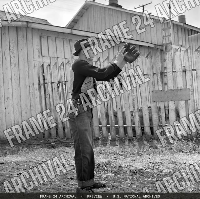Tracy, California. Baseball Recreation. Catch! Try-outs for the town baseball team, vintage black and white photograph